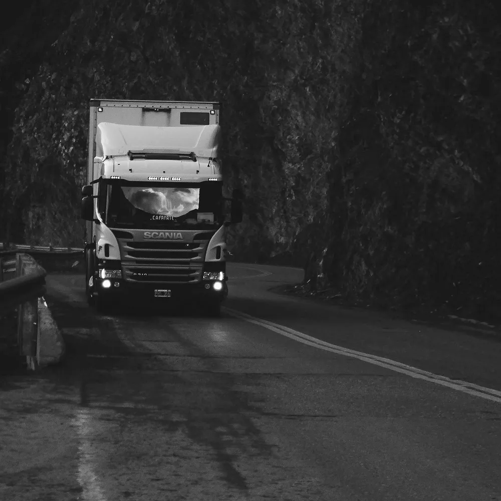 Scania truck transporting goods to warehouse